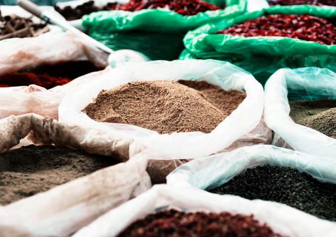 pexels-photo-28699594-28699594 Colorful assortment of spices in bags at a traditional market, showcasing diversity.